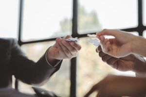 Group business people holding jigsaw puzzle together, share transfers
